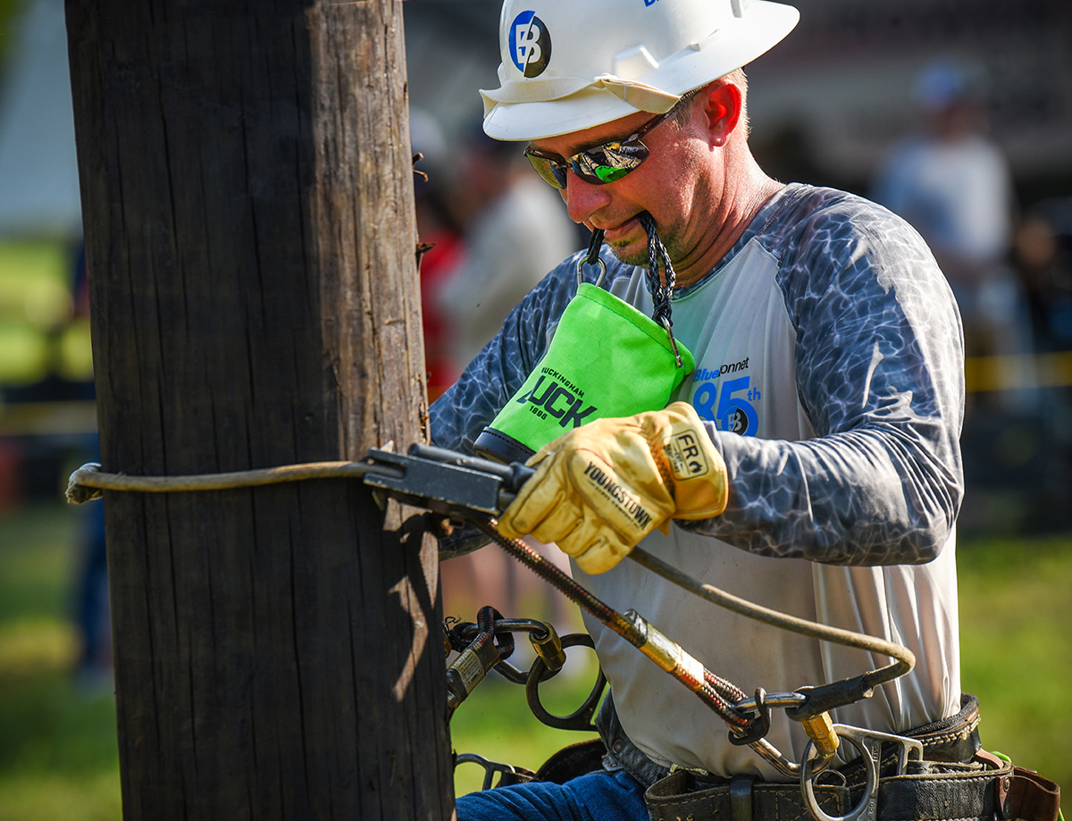 Bluebonnet’s Logan Lancaster from Giddings competes in the Journeyman Pole Climb event