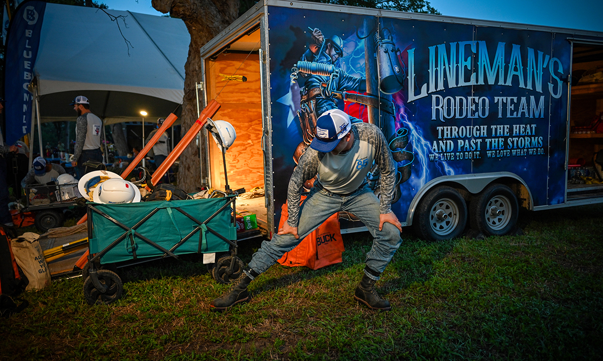 Andrew Murphy (Giddings) from Giddings’s journeyman team stretches as the sun comes up before the event.