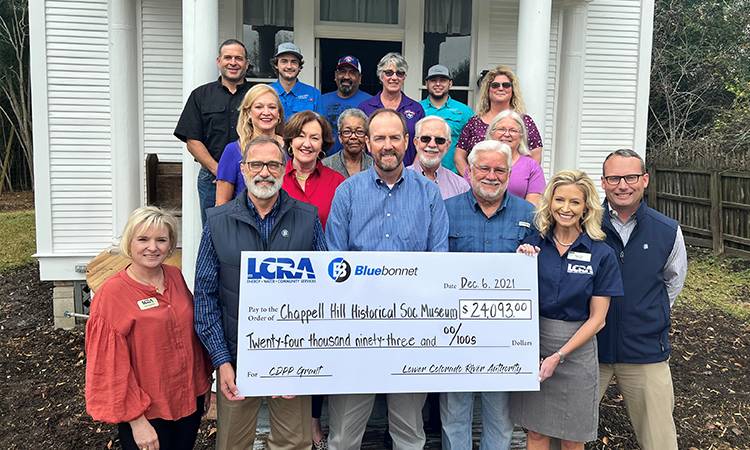 Pictured, from left to right in the front row, are: Kate Ramzinski, LCRA regional affairs representative; Robert Mikeska, Bluebonnet Board secretary/treasurer; Gary Durrenberger, Chappell Hill Historical Society vice president; John Schaer, historical society board member; Margaret D. "Meg" Voelter, LCRA board member; and Kyle Merten, Bluebonnet community development representative. Middle row, from left: Dottie Schaer, historical society grant writer; Elizabeth Rigney, historical society incoming president